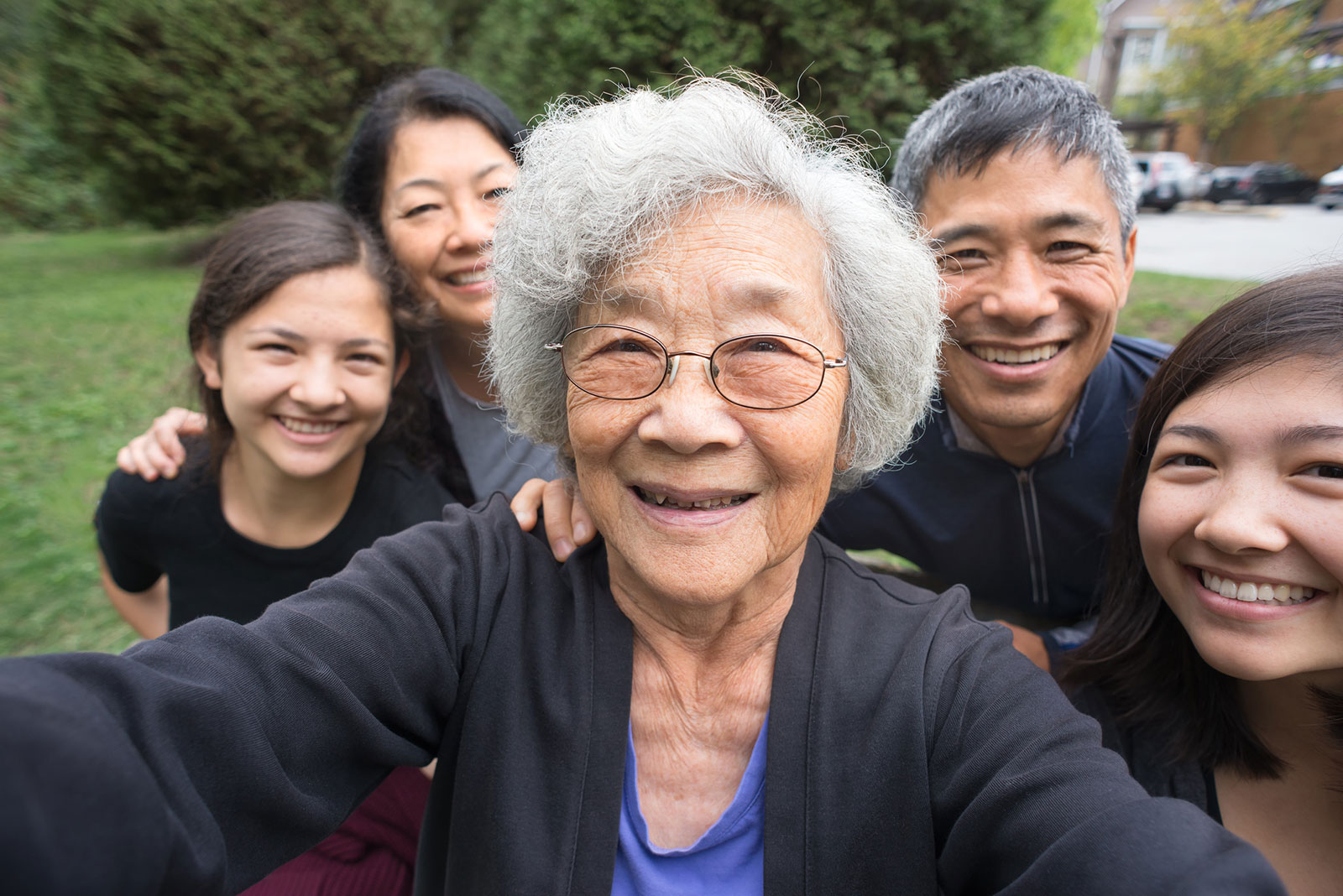 multi-generational asian-american family taking a selfie